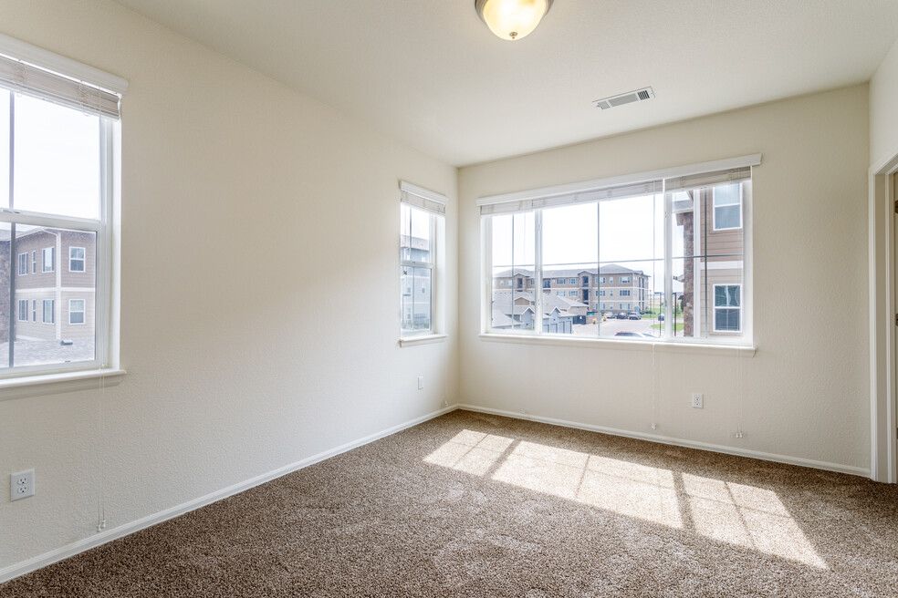 inside of new bedroom with open windows