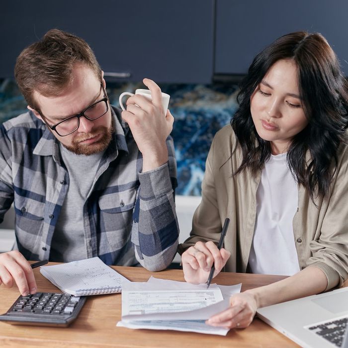 couple figuring out expenses couple figuring out expenses