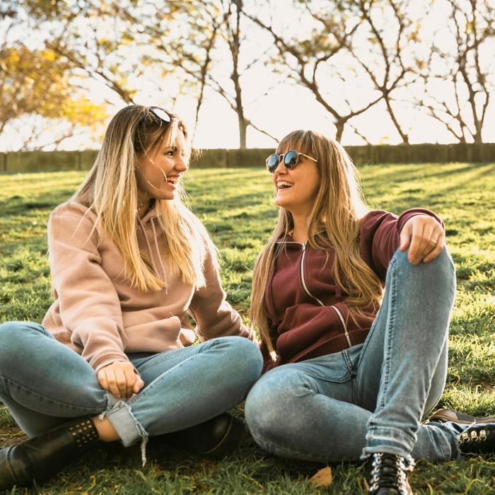 image of two friends in a park