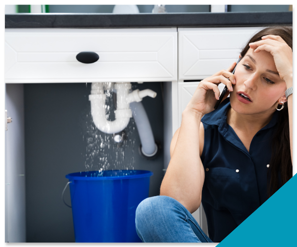 Top Tier Plumbing emergency plumber providing urgent 24/7 service to repair a burst pipe in a Stockton home at night.