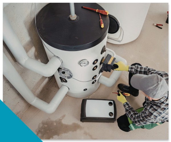 A Top Tier Plumbing technician uses a multimeter for expert water heater repair on a residential gas unit in Stockton.
