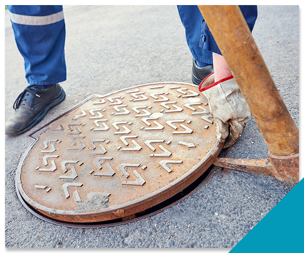 tech opening a manhole