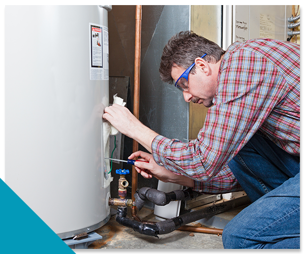 plumber working on a water heater