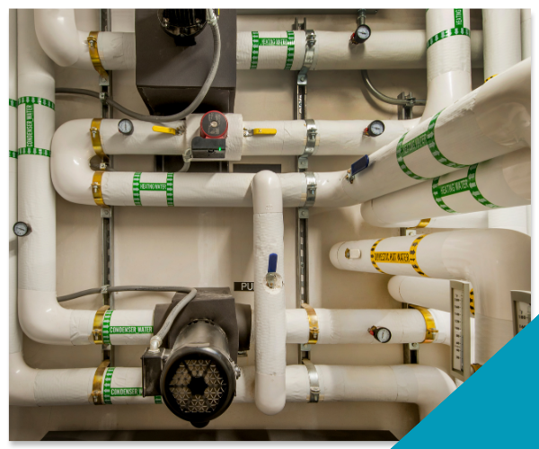 Two Top Tier Plumbing commercial specialists performing complex pipe maintenance and sewer line diagnostics in a Stockton facility.