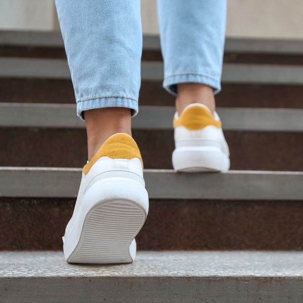 Woman walking up stairs