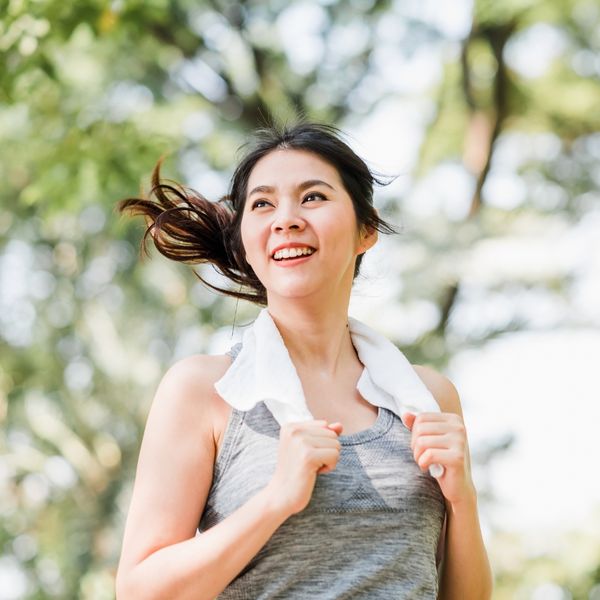 Woman smiling while running