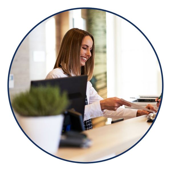 woman at reception desk of business 