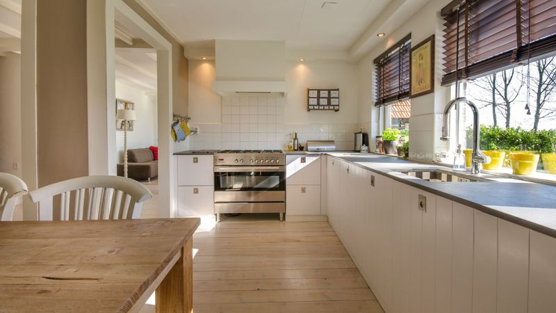 a clean modern kitchen countertop and dining table 