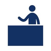 person at office reception desk 