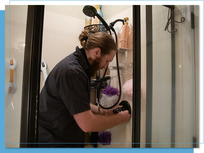 man working on shower