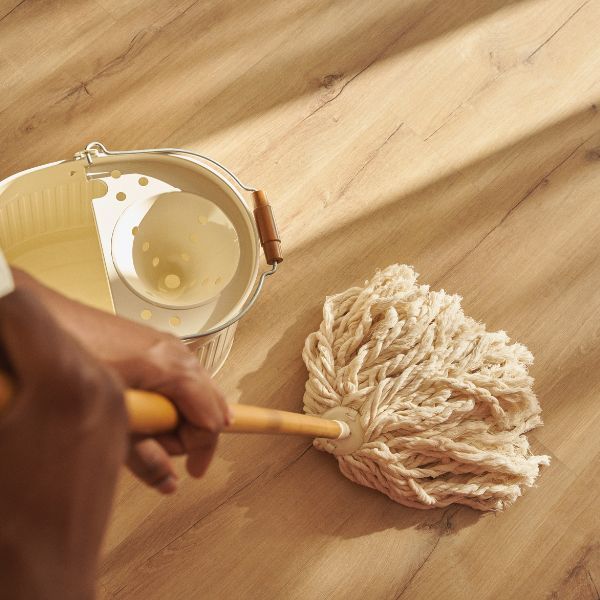 person mopping laminate flooring person mopping laminate flooring