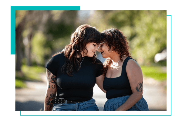 two woman sitting on a bench