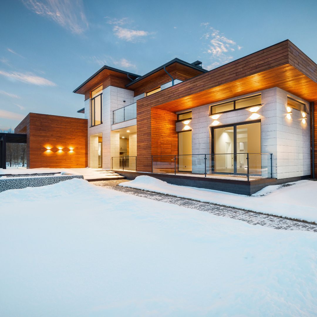 Luxury house with snow on the lawn