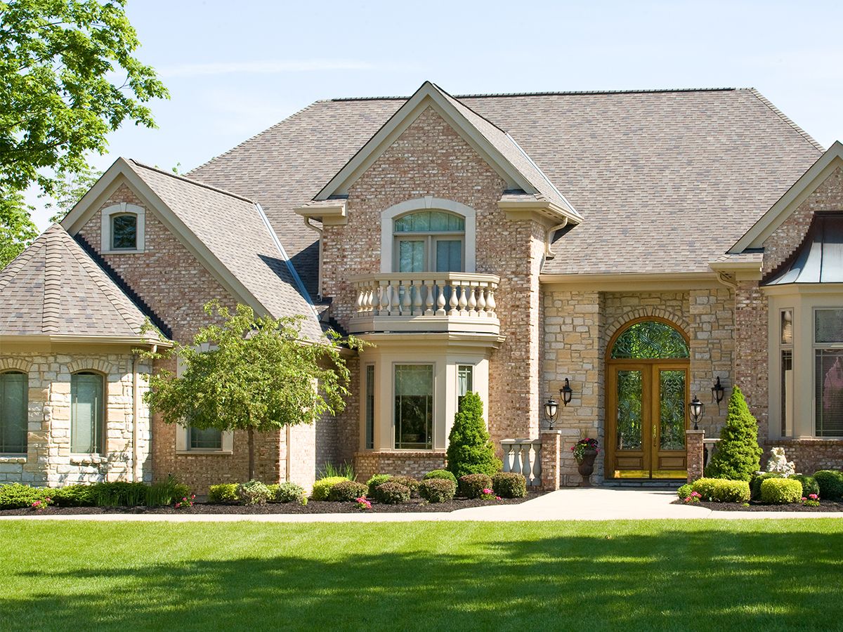 Beautiful luxury home with a green lawn,