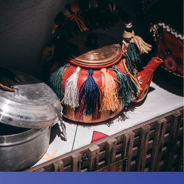 Old tea pot sits on shelf