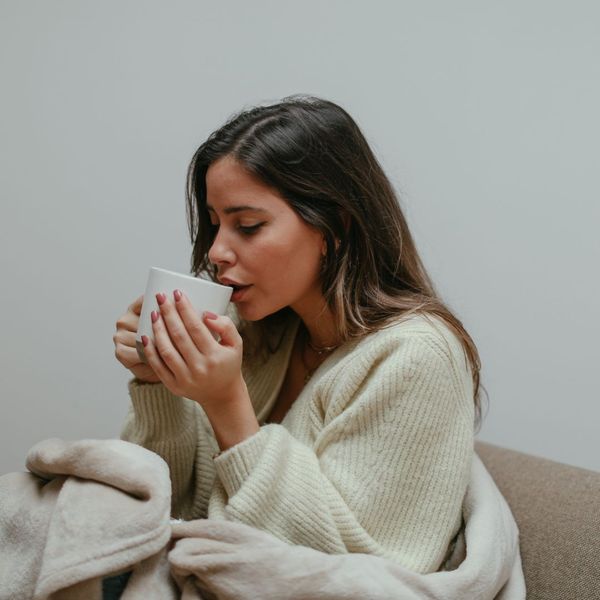 a woman drinking tea The Role of Antioxidants in Cellular Health (4).jpg