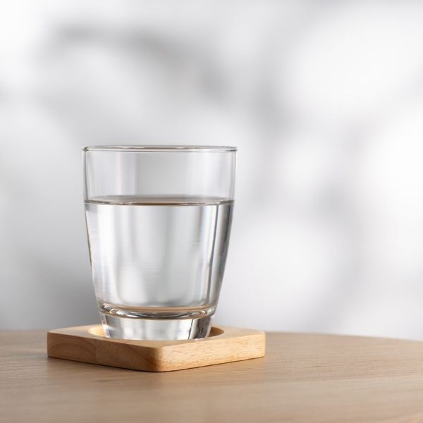 glass of water sitting on coaster glass of water sitting on coaster