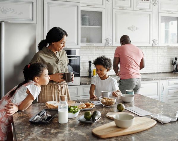 A family cooking together. A family cooking together.