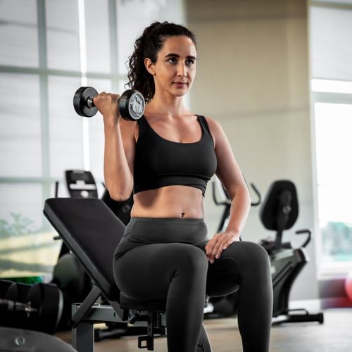 Woman lifting weights. Woman lifting weights.