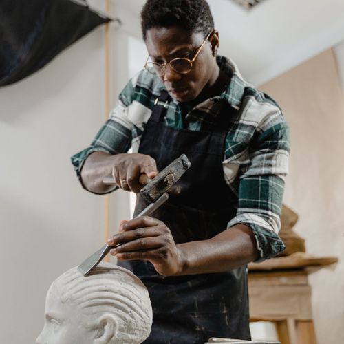sculptor working sculptor working