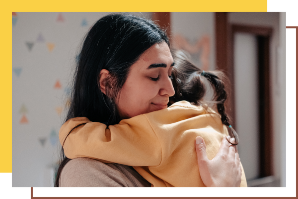 image of mom hugging a child