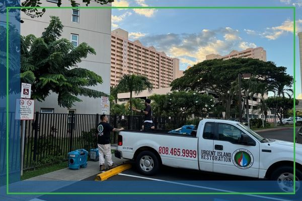Urgent Island restoration truck outside business