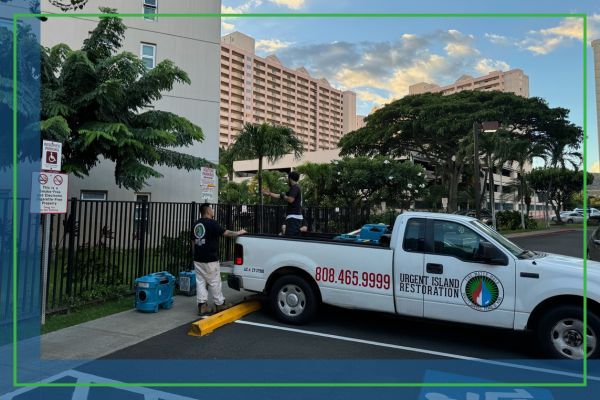 Urgent Island restoration truck outside business 