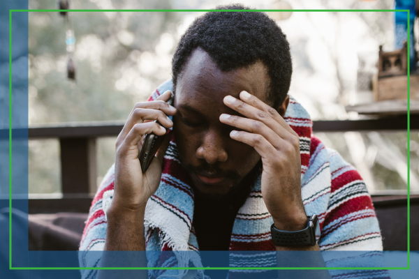 A stressed man on the phone