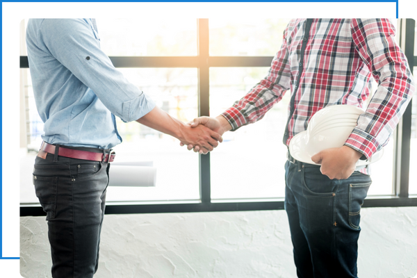 Contractor shaking hands with client