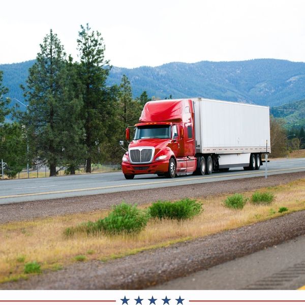 red semi driving down california highway