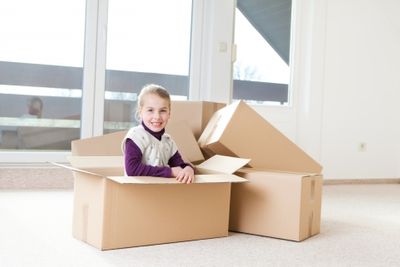 Girl sitting in box