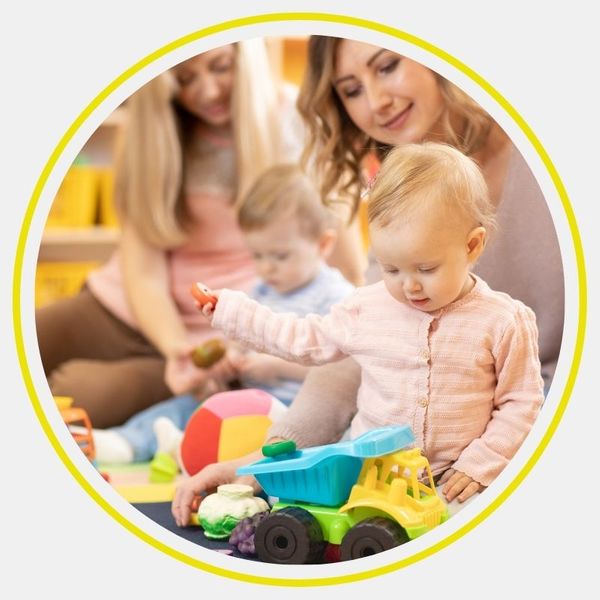infants playing with toys at daycare