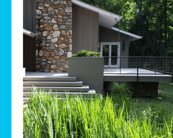 Image of a gray house with a matching TimberTech® deck