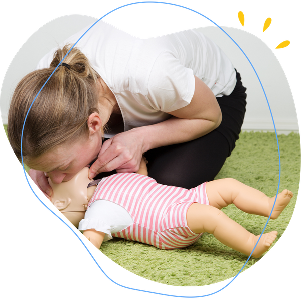 Woman doing CPR on a baby dummy