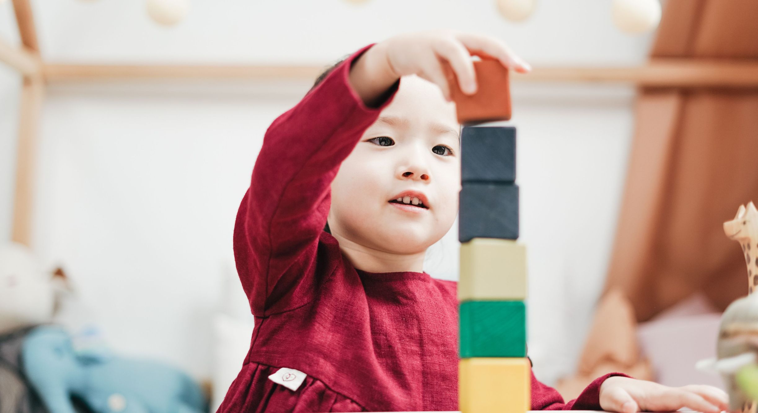 Child playing with blocks in daycare