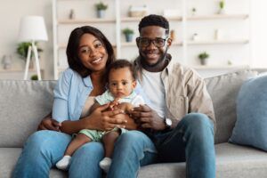 portrait of happy black family smiling at home