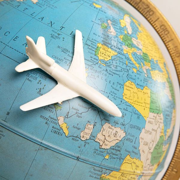 a model plane on a globe