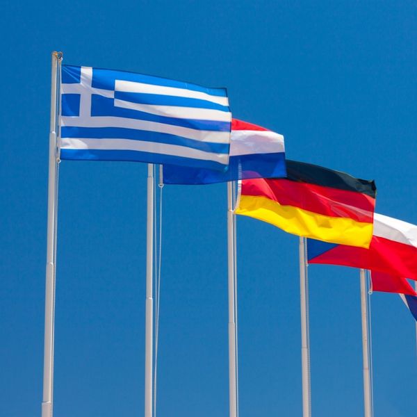 Two people having a conversation Country Flags