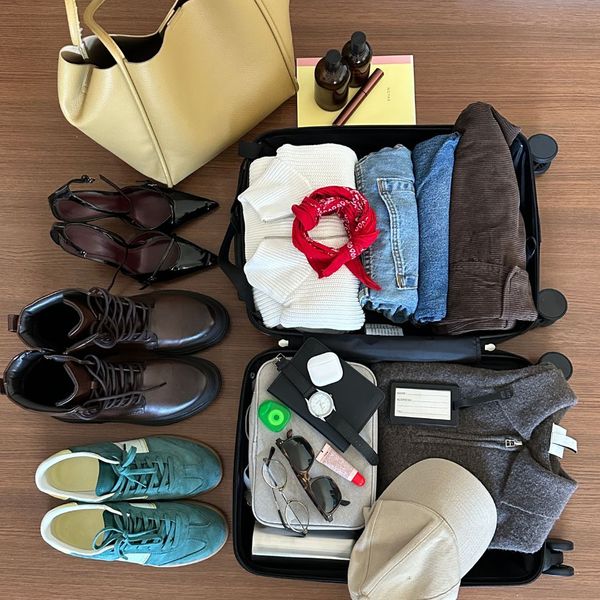 open suitcase being packed, ready for a trip
