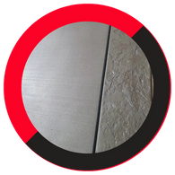 A close-up of a transition between smooth finished concrete and textured, stamped concrete in a grey tone, framed by a red and black circular border. A close-up of a transition between smooth finished concrete and textured, stamped concrete in a grey tone, framed by a red and black circular border.