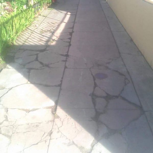 Cracked driveway before repaired by RAD Concrete Cracked driveway before repaired by RAD Concrete