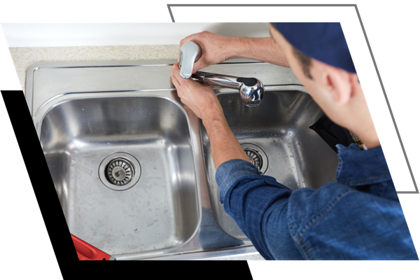 plumber working on a faucet