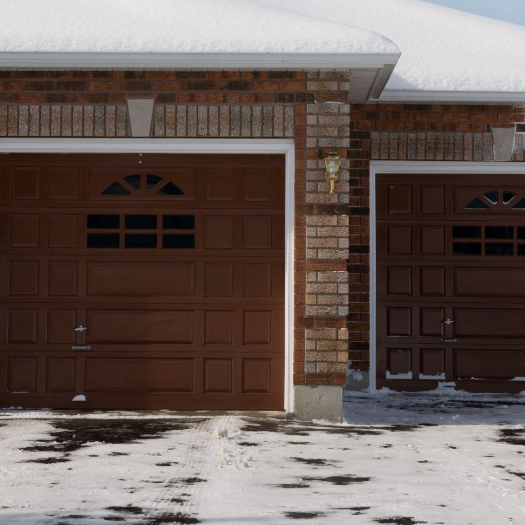 snow and ice near garage doors