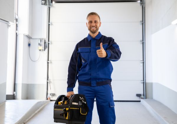 garage door contractor giving thumbs up