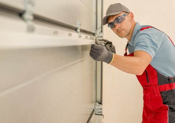 garage door contractor repairing door