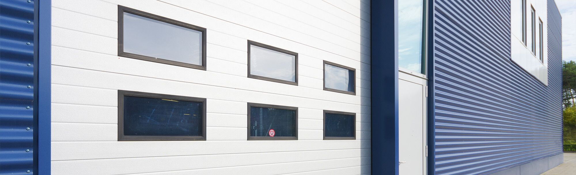 Commercial business building with a large garage door