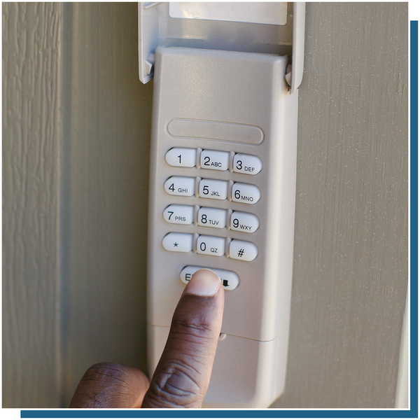 someone punching code into garage opener keypad