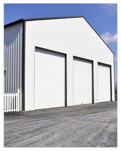 A commercial building with multiple large garage doors