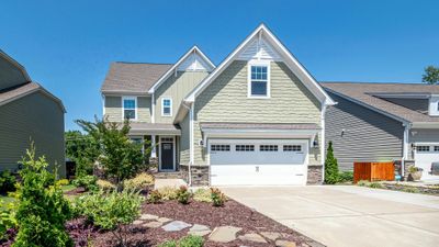 a home with a garage Why Leave Garage Door Repair to the Professionals Hero.jpg