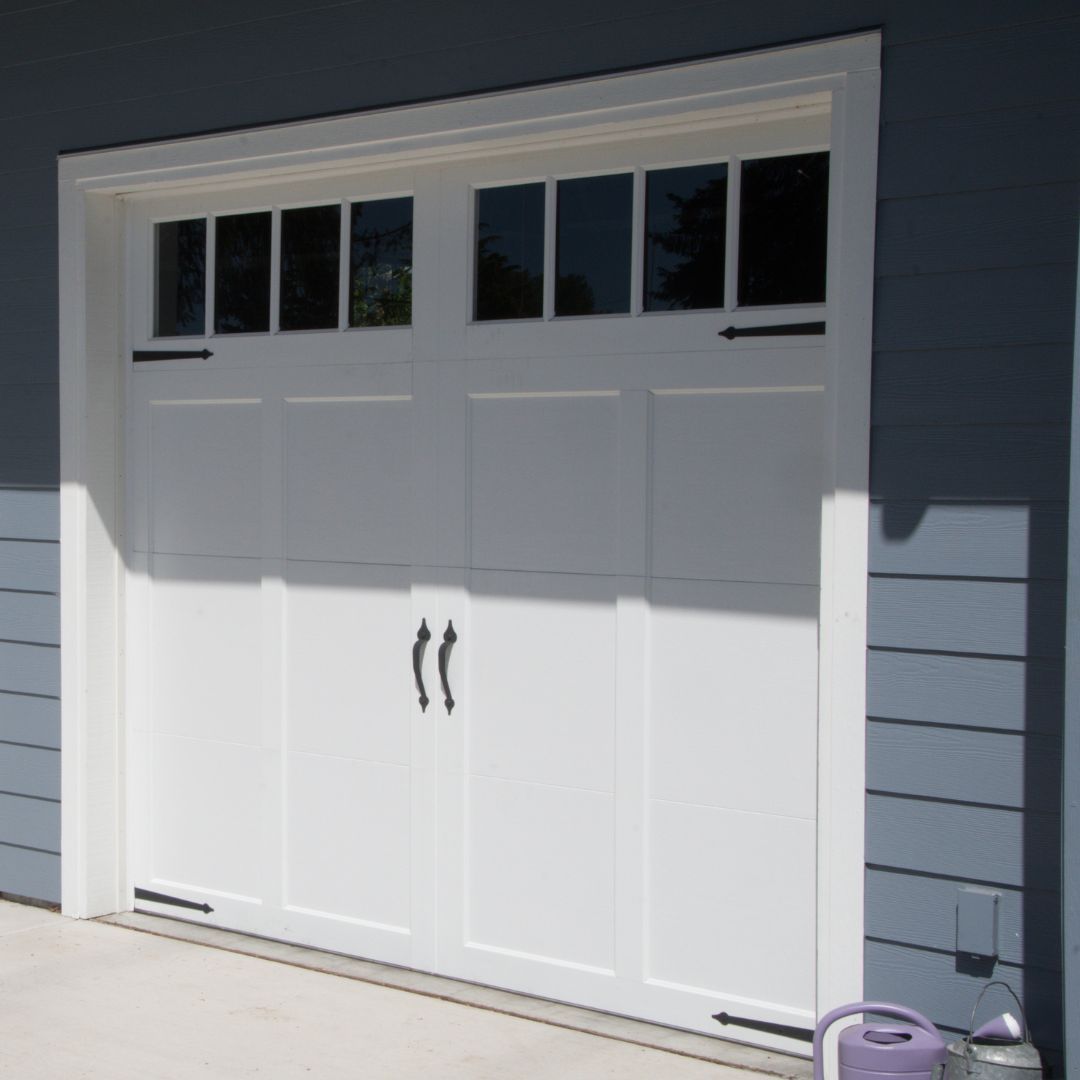 White garage door with black accents.